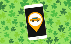 Rideshare app on smartphone, green clover background