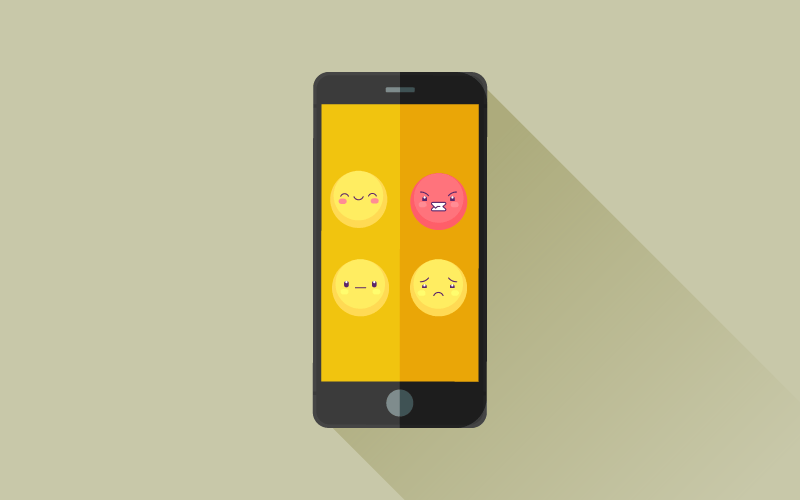 A smartphone screen with multiple emojis conveying different emotions