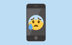 A graphic of a smartphone with an anxious-looking emoji displayed on the screen