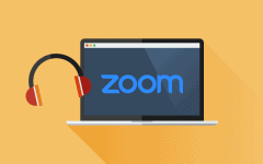 A graphic of a laptop displaying the Zoom logo with headphones next to it