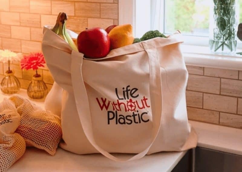 cloth bag with vegetables and fruits on a kitchen countertop