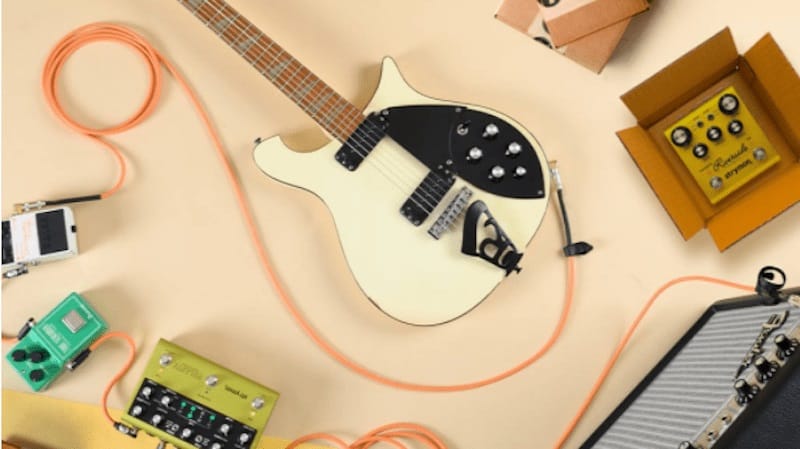 white electric guitar with other music accessories