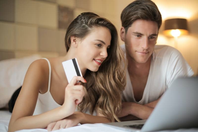 Couple shopping online with credit card